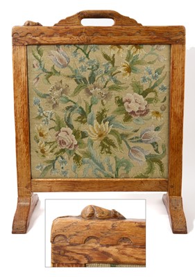 Lot Rare early Robert Mouseman Thompson carved oak fire screen, square form with integral pierced surmounting carrying handle and obligatory signature carved mouse to the top rail, over carved penda...