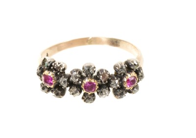 Lot 430 - Antique ruby and diamond triple flower head cluster ring