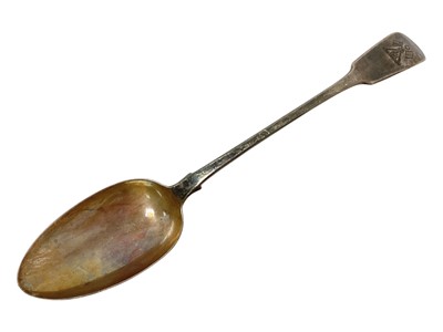 Lot 260 - George IV silver fiddle pattern basting spoon with engraved crest