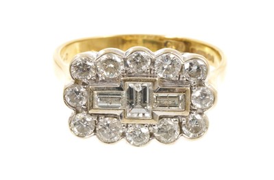 Lot Diamond cluster ring with three baguette cut diamonds surrounded by a border of 12 brilliant cut diamonds in 18ct gold setting, estimated total diamond weight approximately 2cts