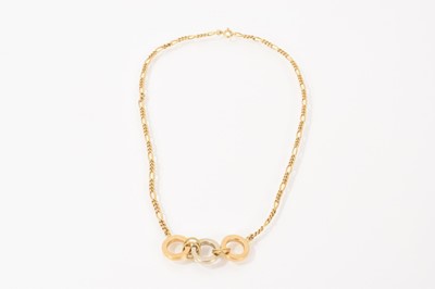 Lot 463 - 18ct gold pendant necklace with one white gold and two yellow gold circular links on an 18ct gold figaro chain, 39.5cm long