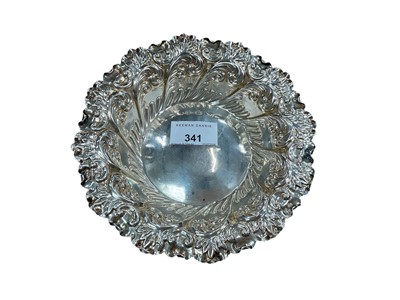 Lot 341 - Late Edwardian silver dish, with embossed foliate and scroll decoration (Sheffield date mark rubbed) Fenton Brothers Ltd. All at approximately 4.21ozs. 17cm diameter.