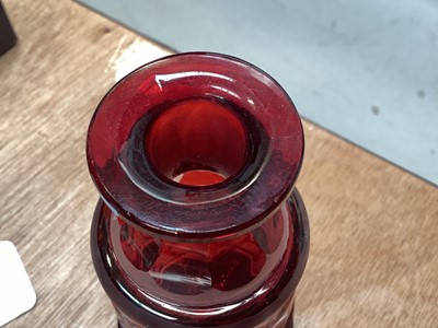 Lot 5076 - Victorian gilded cranberry scent bottle measuring 12cm tall together with a Bohemian red overlay hand engraved scent bottle measuring 16cm tall