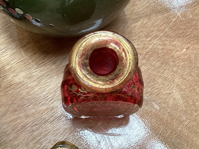 Lot 5076 - Victorian gilded cranberry scent bottle measuring 12cm tall together with a Bohemian red overlay hand engraved scent bottle measuring 16cm tall