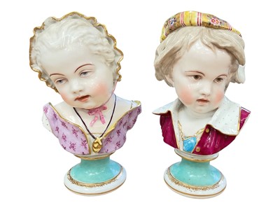 Lot 114 - Pair of late 19th century Dresden porcelain busts of children, polychrome painted and gilt, on socle bases, crossed swords marks, 22.5cm high