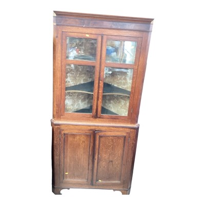 Lot 5366 - George III oak glazed two height corner cupboard