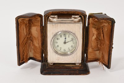Lot 287 - George V silver cased desk clock of rectangular form, with engine turned decoration