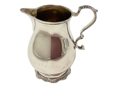Lot 292 - Fine quality contemporary silver cream jug of baluster form, with leaf mounted scroll handle