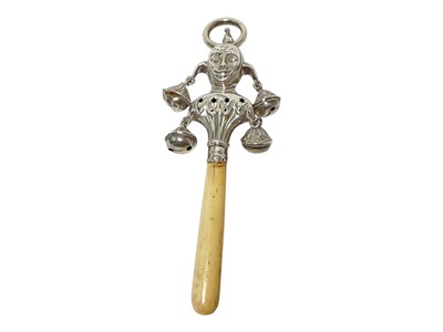 Lot 293 - George V silver child's rattle, in the form of a jester's head with four bells, bone teether
