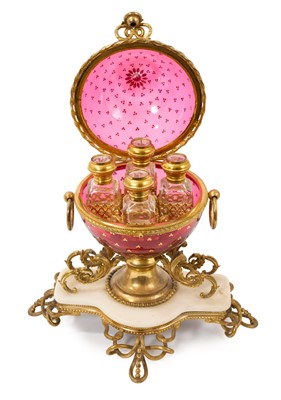Lot 718 - Fine quality Palais Royale ormolu, white marble and cranberry glass scent bottle casket, the globular casket housing four cut glass scent bottles, the lids decorated with Paris scenes, supported...