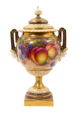 Lot 144 - Royal Worcester twin-handled vase and cover, of urn form, painted with fruit by Freeman, shape number 2363, stamped mark to base, 21cm high