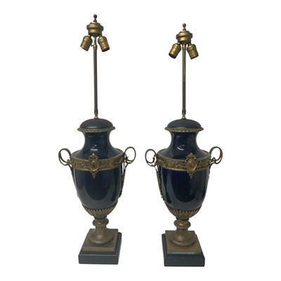 Lot 714 - Pair of Classical Revival table lamps, each of urn form with bronze mounts, on square plinth base, 96cm high