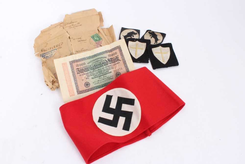 Lot 555 - Nazi party arm band with RZM paper label to interior, numbered - 344686 together with some other cloth badges