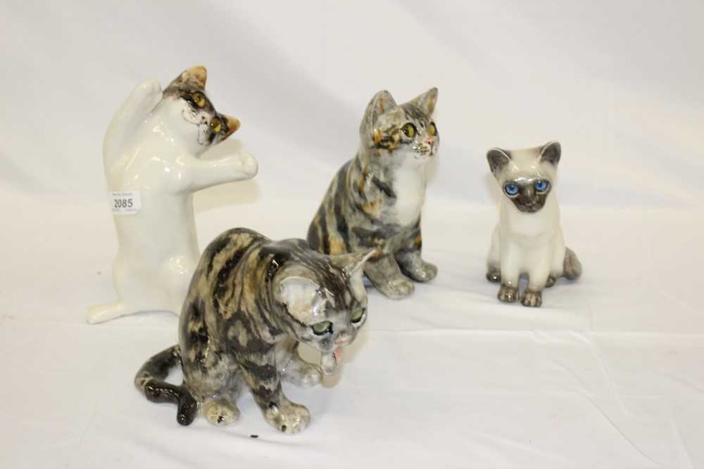Lot 2085 - Four Winstanley china cats