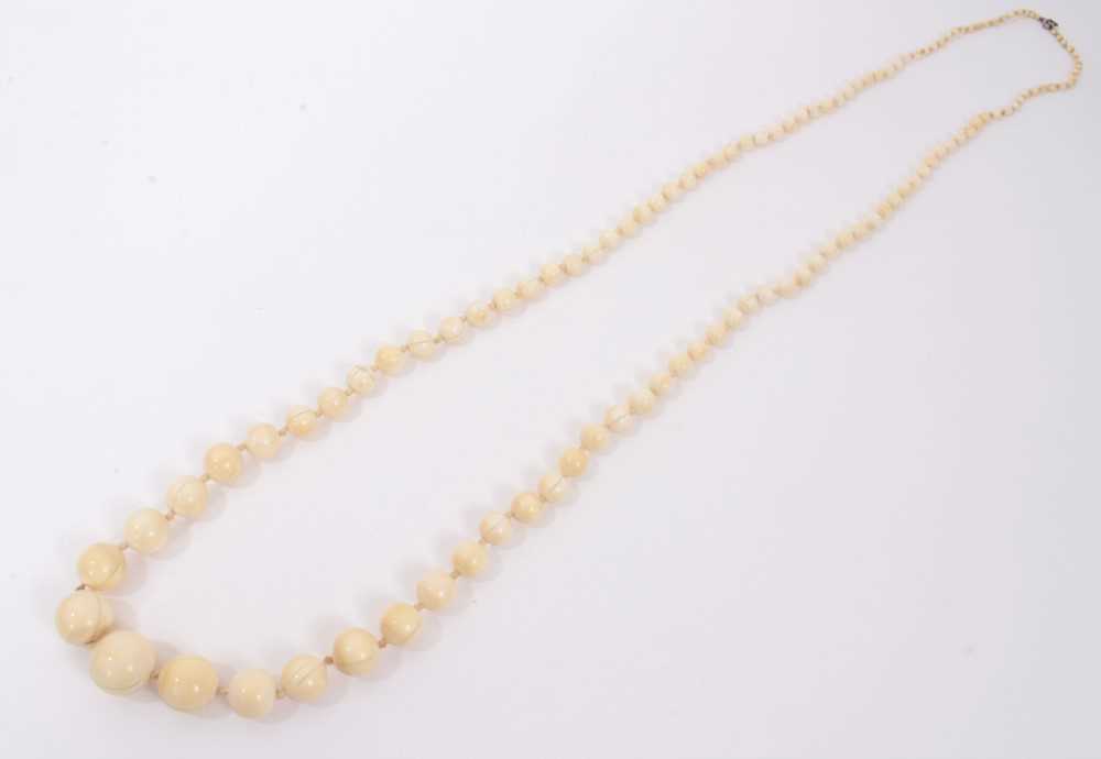 Lot 738 - Antique ivory bead necklace with a string of 119 graduated ivory beads ranging from 3.75mm - 23mm. Length 137cm.