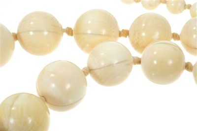 Lot 738 - Antique ivory bead necklace with a string of 119 graduated ivory beads ranging from 3.75mm - 23mm. Length 137cm.