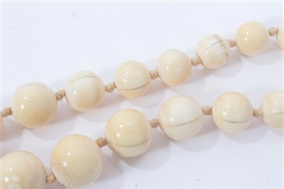 Lot 738 - Antique ivory bead necklace with a string of 119 graduated ivory beads ranging from 3.75mm - 23mm. Length 137cm.