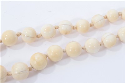 Lot 738 - Antique ivory bead necklace with a string of 119 graduated ivory beads ranging from 3.75mm - 23mm. Length 137cm.