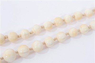 Lot 738 - Antique ivory bead necklace with a string of 119 graduated ivory beads ranging from 3.75mm - 23mm. Length 137cm.