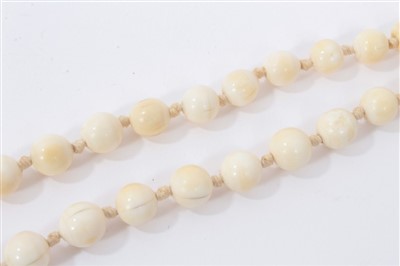 Lot 738 - Antique ivory bead necklace with a string of 119 graduated ivory beads ranging from 3.75mm - 23mm. Length 137cm.