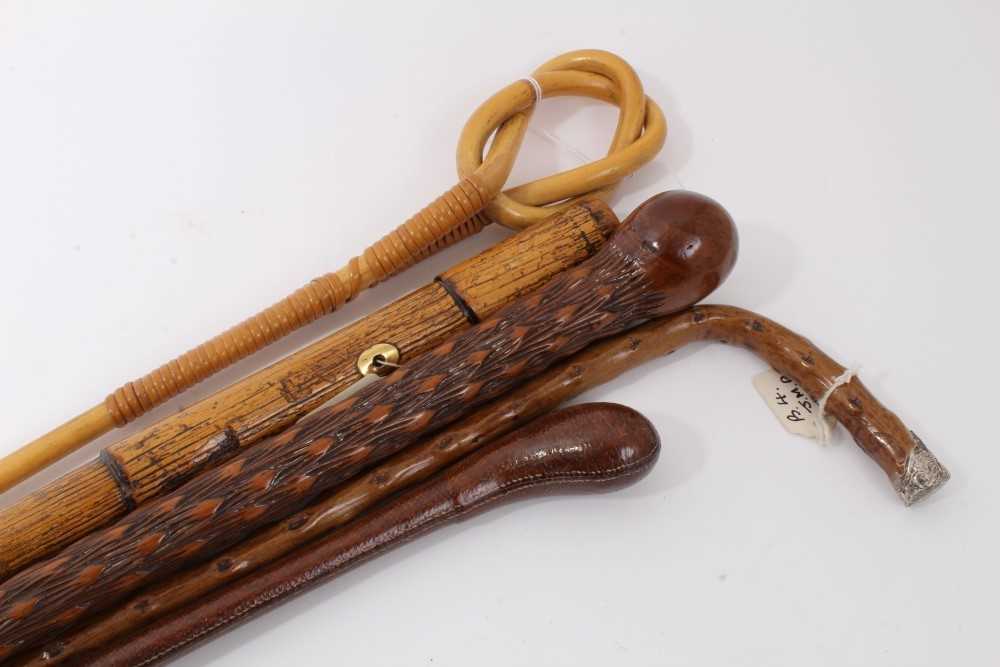 Lot 3705 - Old stepped Malacca walking cane with gold coloured eyelets together with a Congo cane stick, another with silver mounted crutch handle (Birmignham 1899), a knotted bamboo walking cane and a leathe...