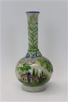 Lot 2066 - Antique Iznik pottery bottle vase decorated...