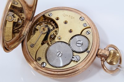 Lot 147 - Gentlemans 9ct gold Omega half Hunter pocket watch with subsidiary seconds , signed dial and stem wind movement - the case 50mm , weighs 94 grams gross