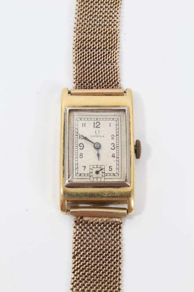 Lot 264 - 1930s gentlemans 18ct gold Omega  retangular wristwatch with silvered dial on 9ct gold mesh bracelet strap