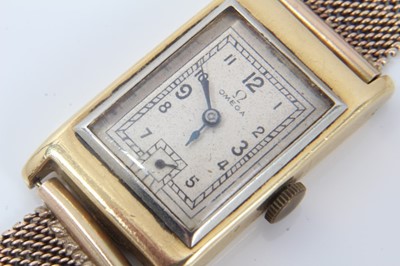 Lot 264 - 1930s gentlemans 18ct gold Omega  retangular wristwatch with silvered dial on 9ct gold mesh bracelet strap
