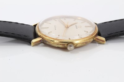 Lot 178 - 1970s gentlemens Omega Genève wristwatch with 17 jewel 601 calibre movement, the circular brushed satin dial with applied gold dart hour markers and centre seconds, in gold plated circular case, on...