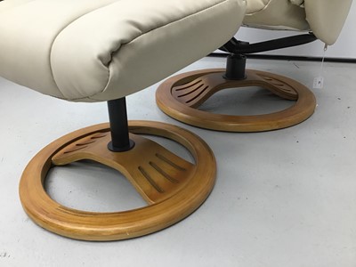 Lot 76 - Cream leather easy chair and footstool