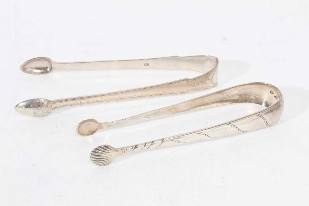 Lot 503 - Pair of George III Irish silver sugar tongs, and a pair of Scottish Provincial silver sugar tongs