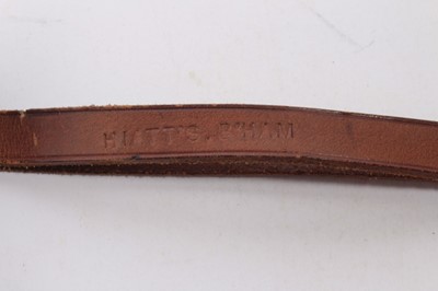 Lot 878 - 20th century turned wood police truncheon with ribbed grip and brown leather strap stamped Hiatt's. B.ham, named in ink W. H. La Touche, 38cm in length