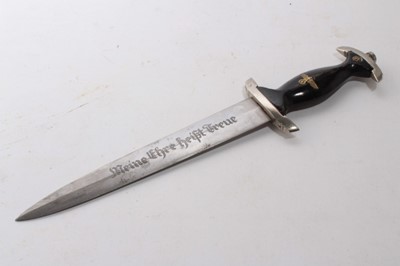 Lot 968 - Composite Nazi SS model 1933 dagger, later painted wooden grip and insignia, the blade etched 'Meine Ehre heist True', in black painted scabbard with nickel mounts.