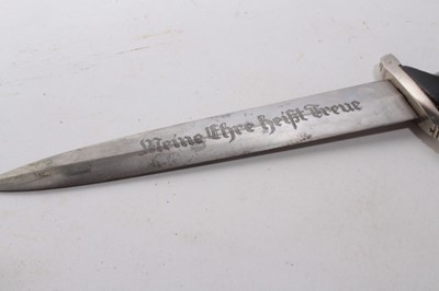 Lot 968 - Composite Nazi SS model 1933 dagger, later painted wooden grip and insignia, the blade etched 'Meine Ehre heist True', in black painted scabbard with nickel mounts.