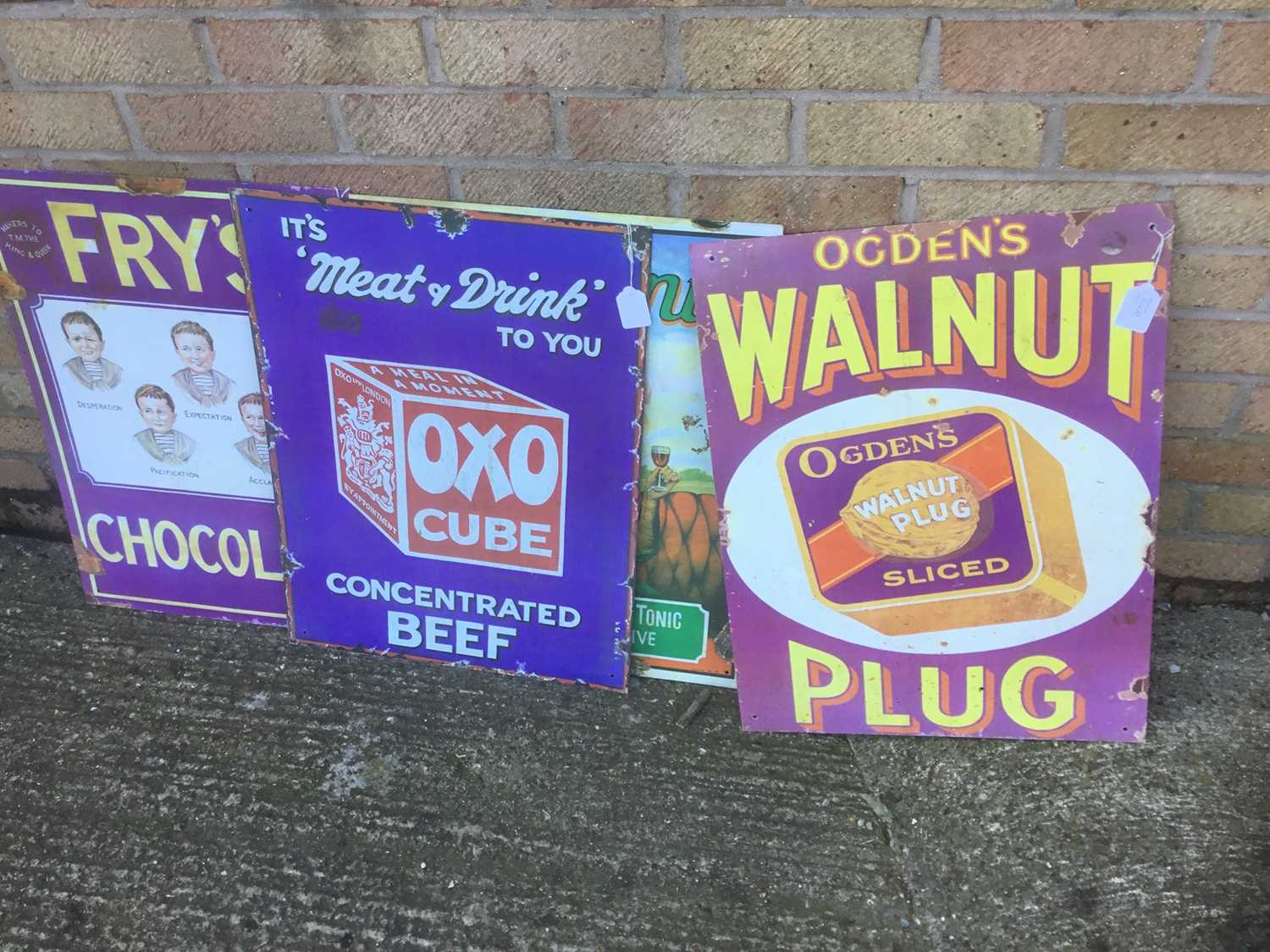 Lot 2400 - Four Reproduction metal advertising signs- Fry's Chocolate, Oxo Cubes, Ogden's Walnut Plug and one other (4)