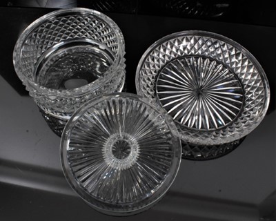 Lot 44 - Georgian cut glass butter tub and lid on stand, together with a pair of cut glass urns and covers