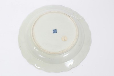 Lot 13 - Worcester plate, circa 1770, of fluted form, polychrome painted with exotic birds, on a cobalt blue and gilt-patterned ground, seal mark to base, 19cm diameter