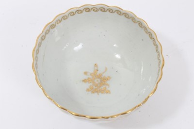 Lot 20 - Worcester fluted tea bowl and saucer, circa 1775-80, decorated in gilt with swags and other patterns, the saucer measuring 14cm diameter