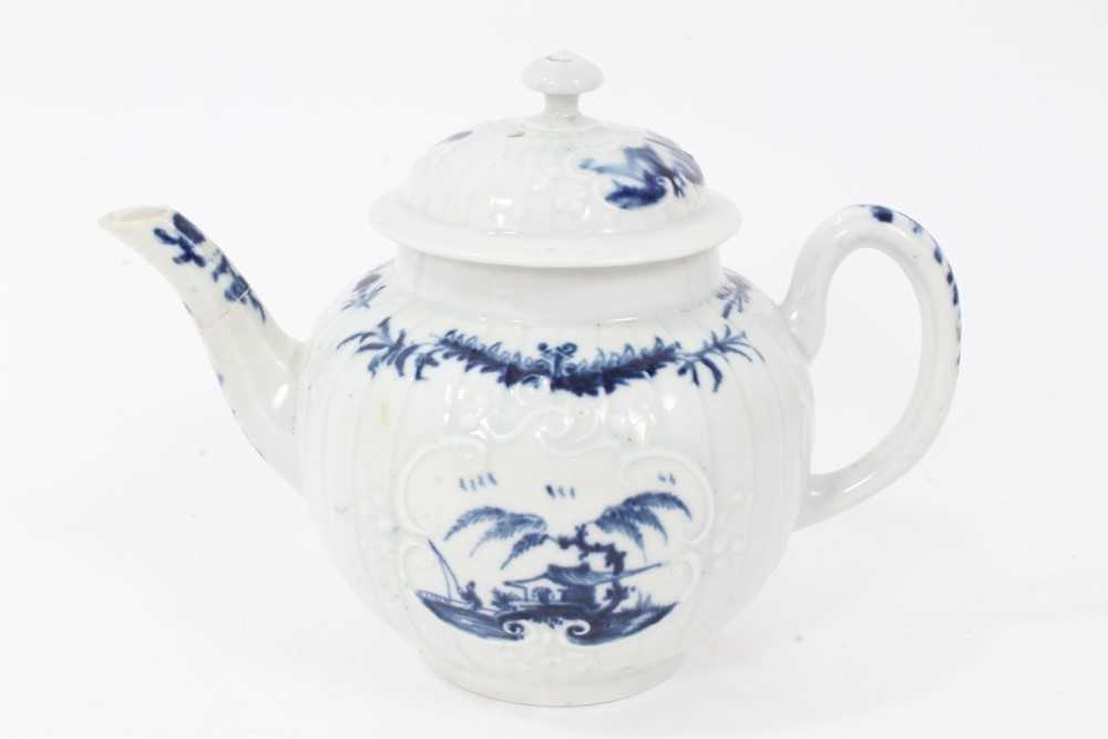 Lot 22 - Rare Worcester small strap-fluted teapot and cover, circa 1755, painted in blue with the Fisherman and Willow Pavilion pattern, workman's mark to base, 11cm high