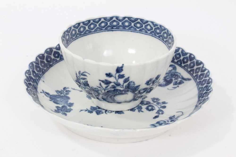 Lot 27 - Caughley tea bowl and saucer, circa 1780, of fluted form, printed in blue with the 'Apple' pattern, the saucer measuring 12.75cm diameter