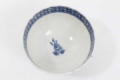 Lot 27 - Caughley tea bowl and saucer, circa 1780, of fluted form, printed in blue with the 'Apple' pattern, the saucer measuring 12.75cm diameter