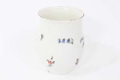 Lot 32 - Derby baluster shaped mug, circa 1760, polychrome painted with floral sprays, red painted rim, 10cm high