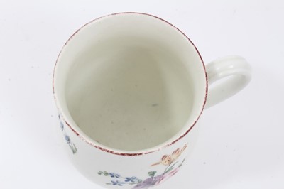 Lot 32 - Derby baluster shaped mug, circa 1760, polychrome painted with floral sprays, red painted rim, 10cm high