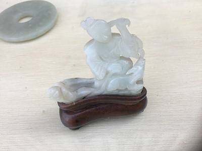Lot 784 - Good Chinese carved jade figure, together with a carved jade bi-disc