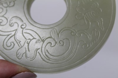 Lot 784 - Good Chinese carved jade figure, together with a carved jade bi-disc