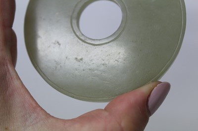 Lot 784 - Good Chinese carved jade figure, together with a carved jade bi-disc