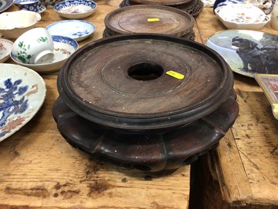Lot 14 - Three good carved wood Chinese stands and a Chinese carved wood figure converted to a lamp
