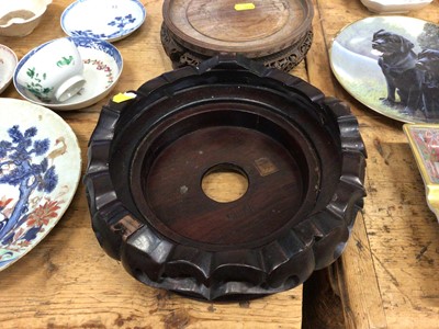 Lot 14 - Three good carved wood Chinese stands and a Chinese carved wood figure converted to a lamp