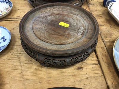 Lot 14 - Three good carved wood Chinese stands and a Chinese carved wood figure converted to a lamp